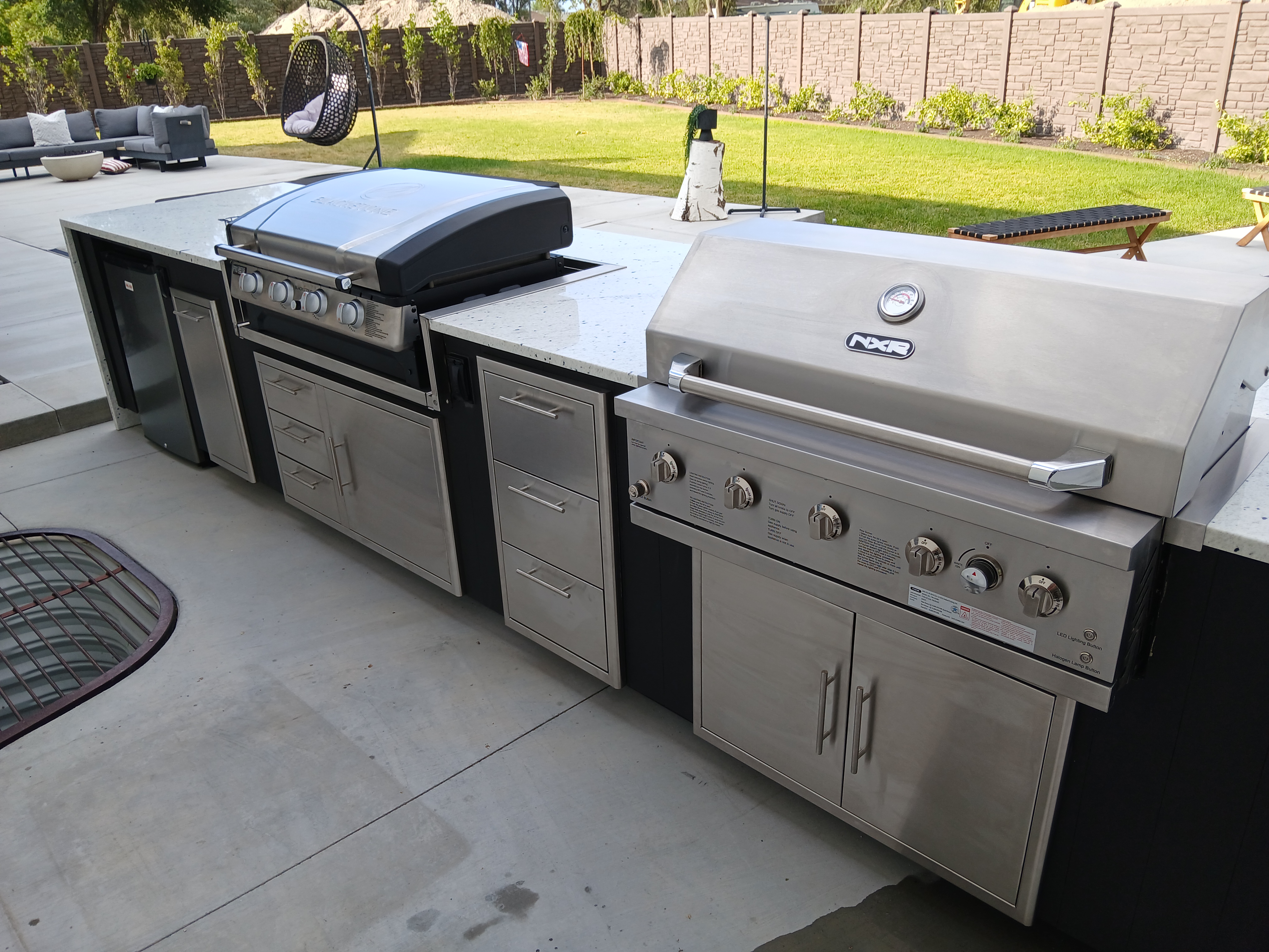 Outdoor kitchen with grill and griddle combo